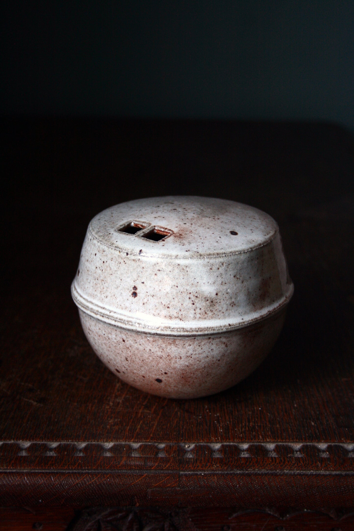 Enclosed form vase