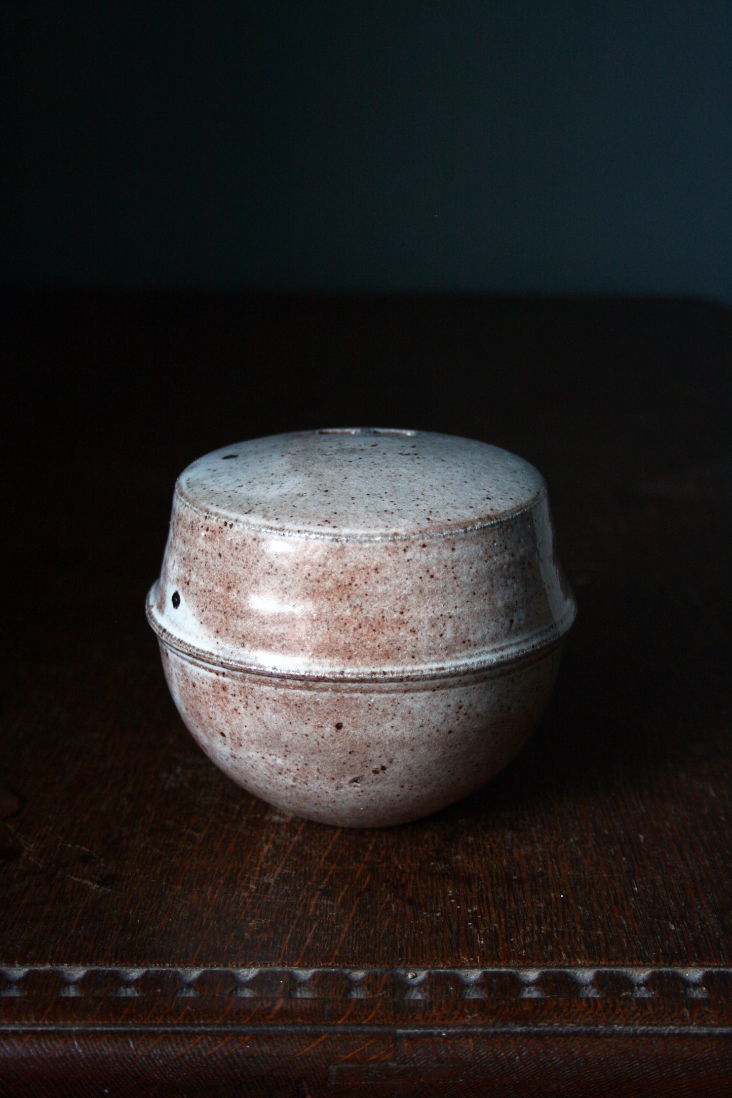 Enclosed form vase