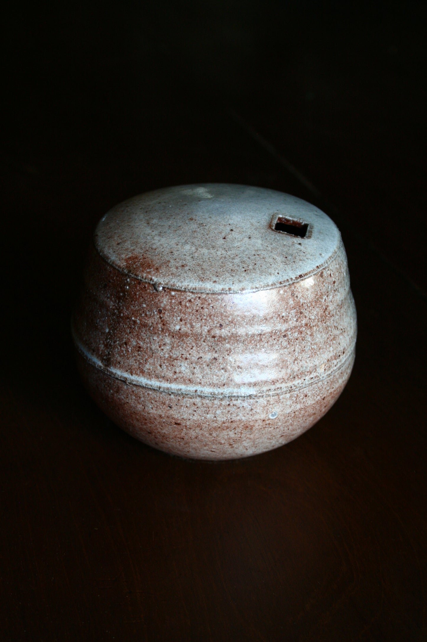Enclosed form vase with square opening