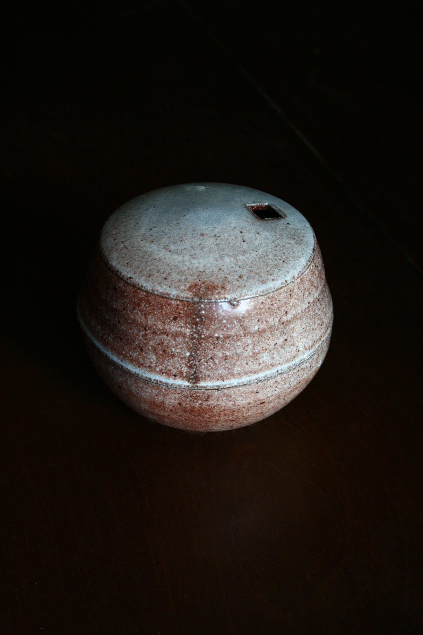 Enclosed form vase with square opening