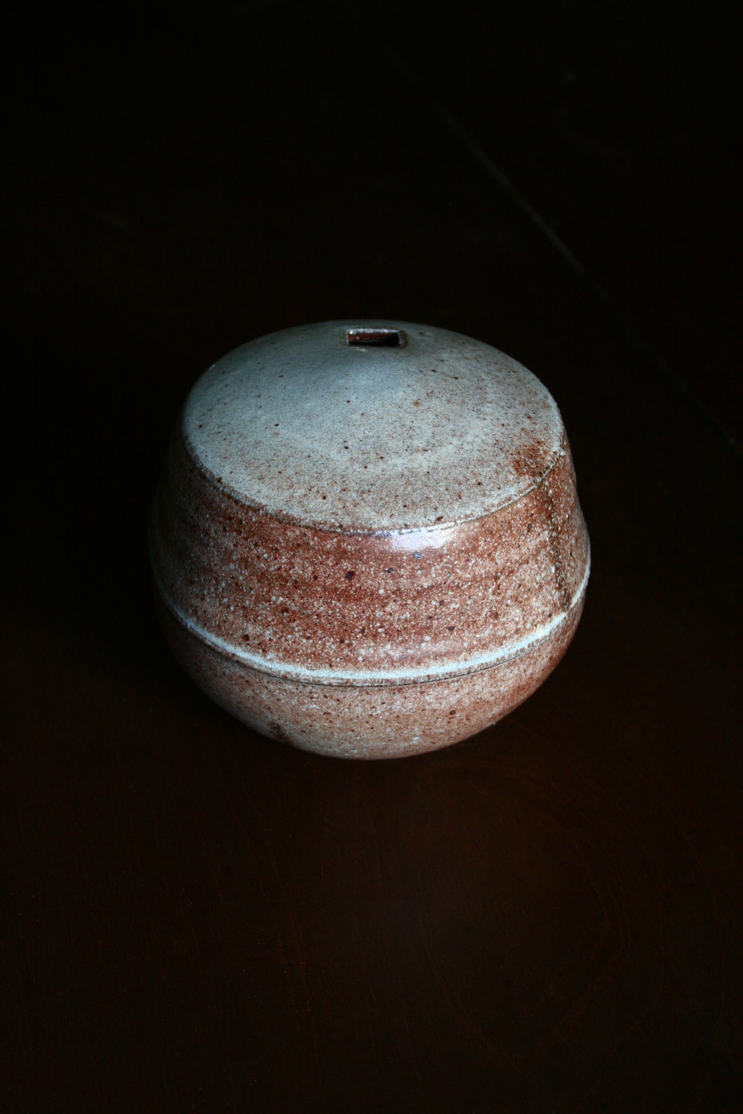 Enclosed form vase with square opening