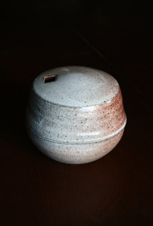 Enclosed form vase with square opening