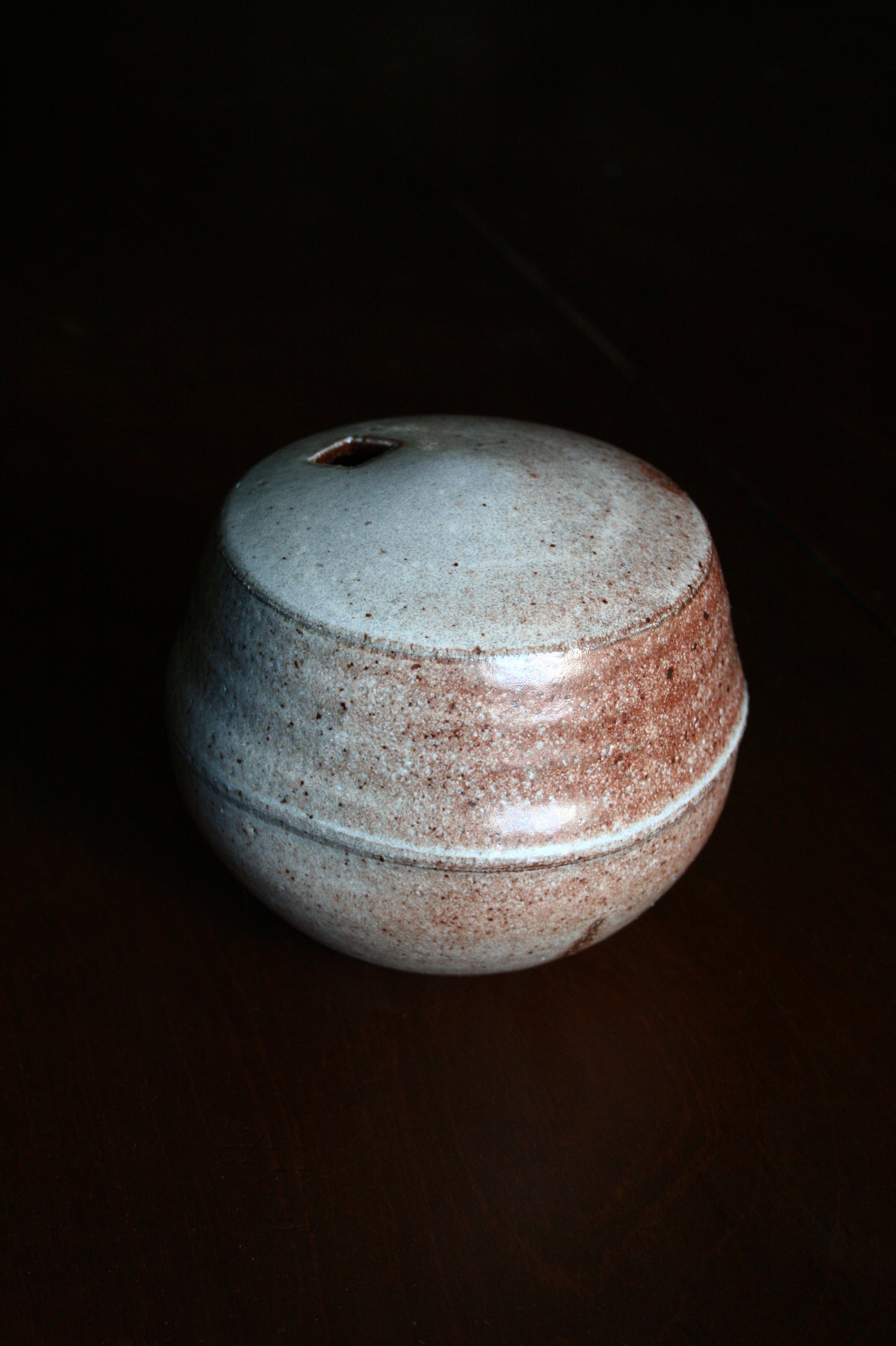 Enclosed form vase with square opening