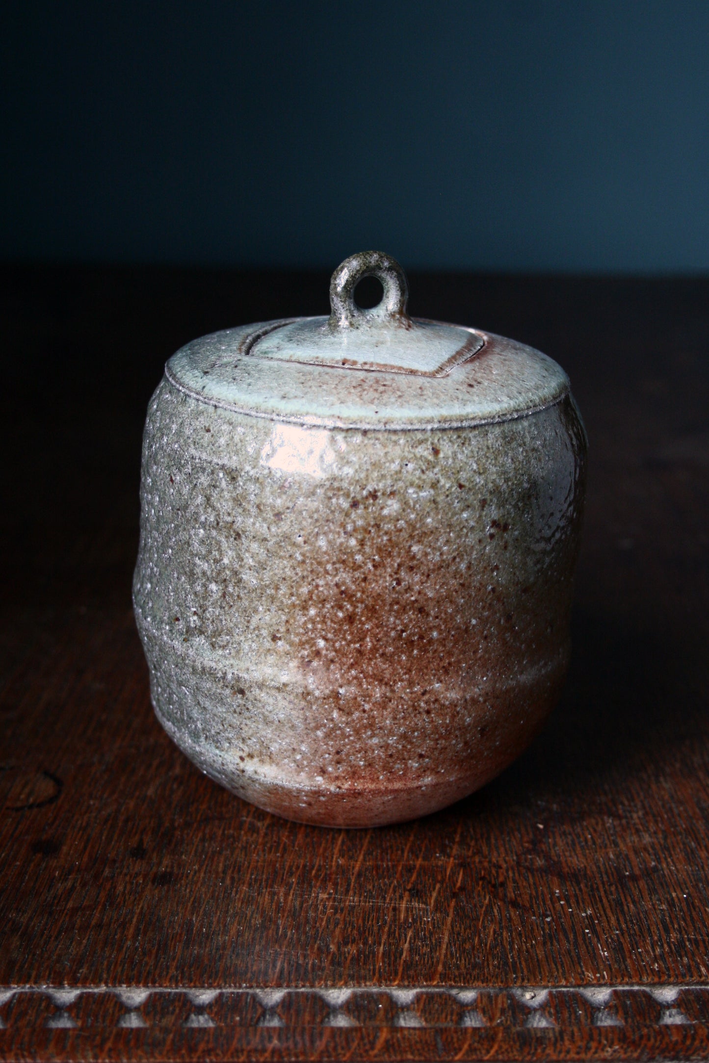 Jar with carved lid