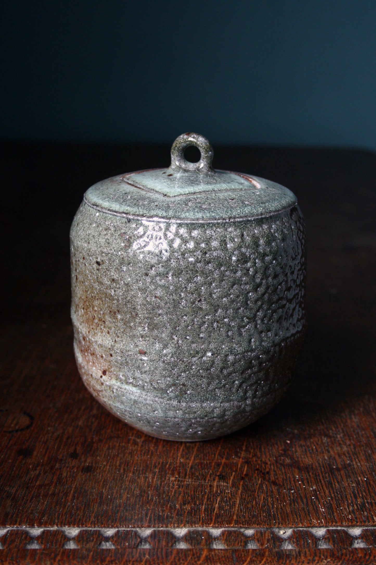 Jar with carved lid
