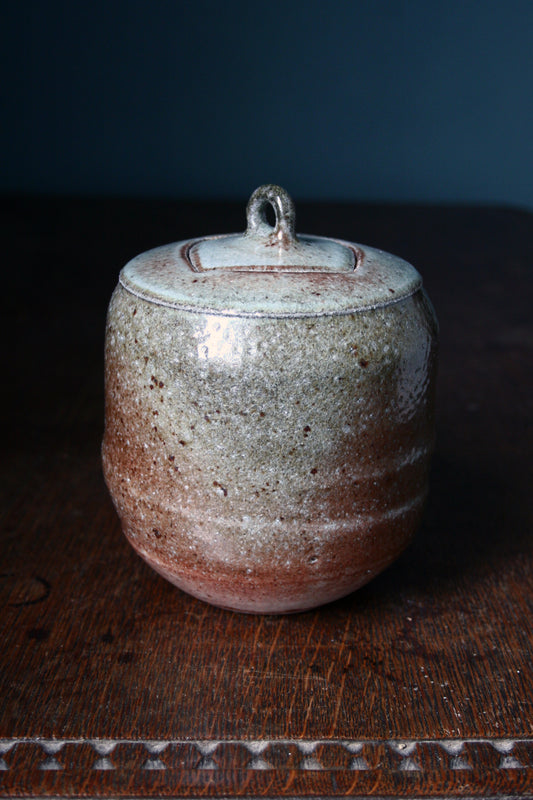 Jar with carved lid