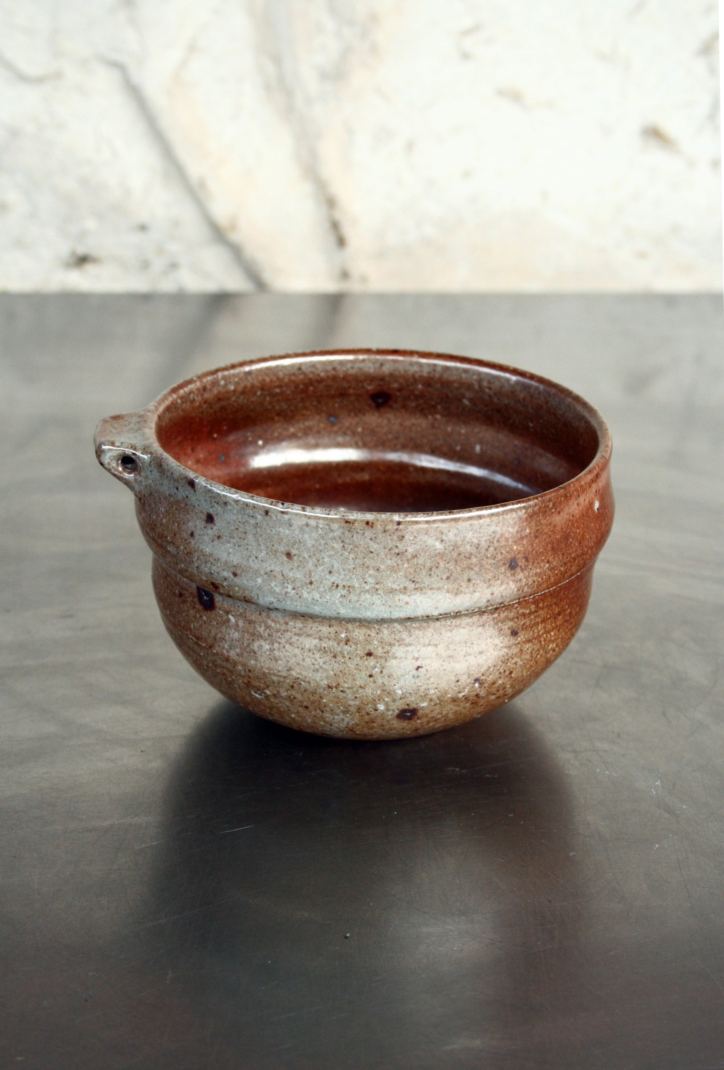 Bowl with pierced lug