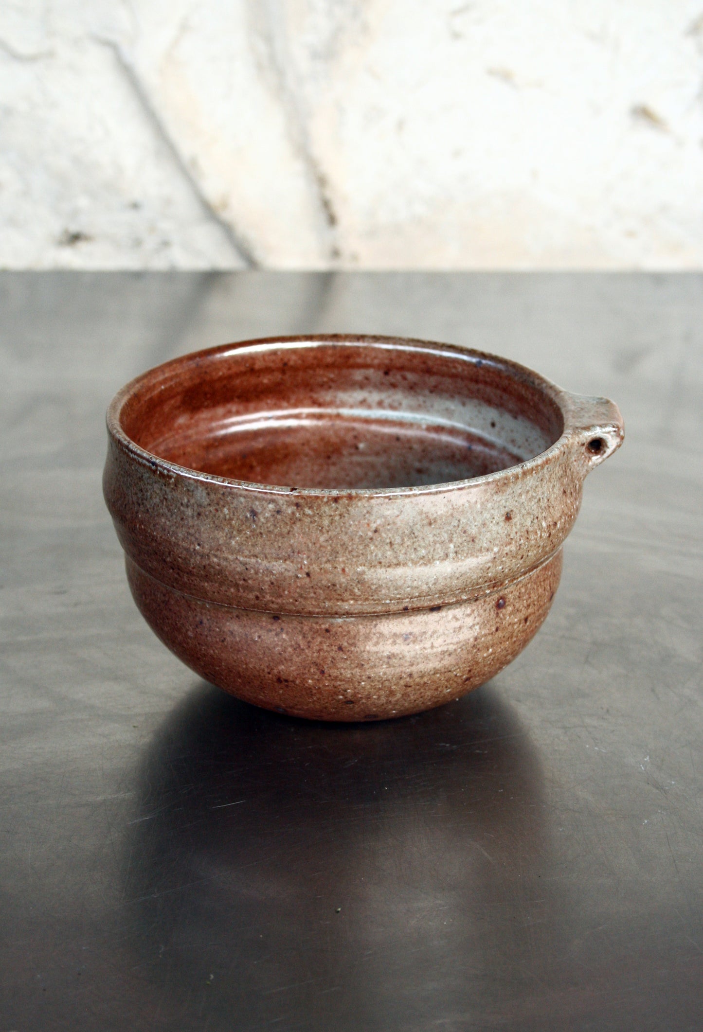 Bowl with pierced lug
