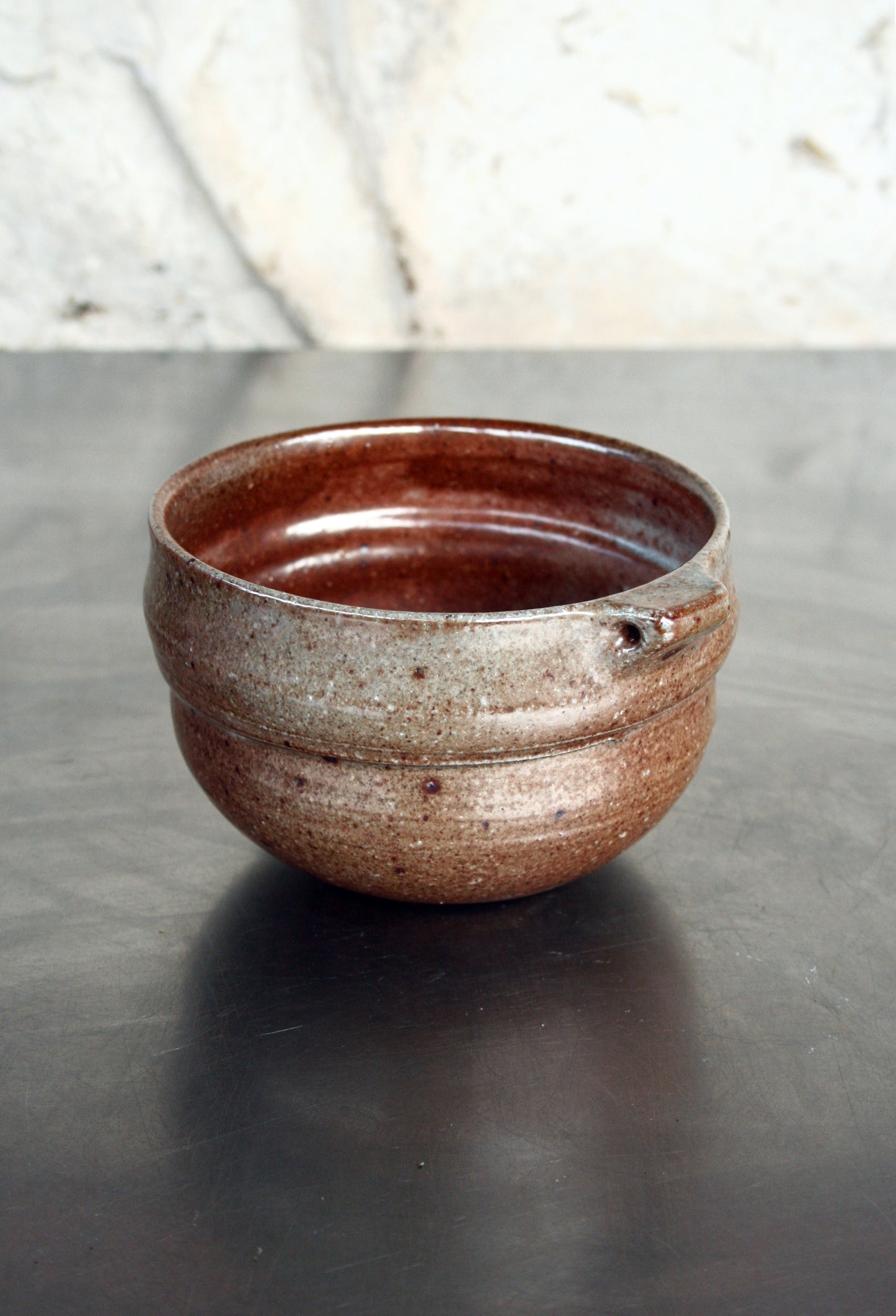 Bowl with pierced lug