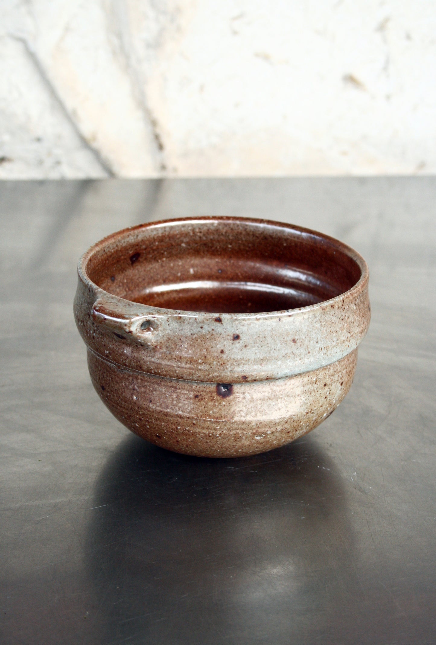 Bowl with pierced lug