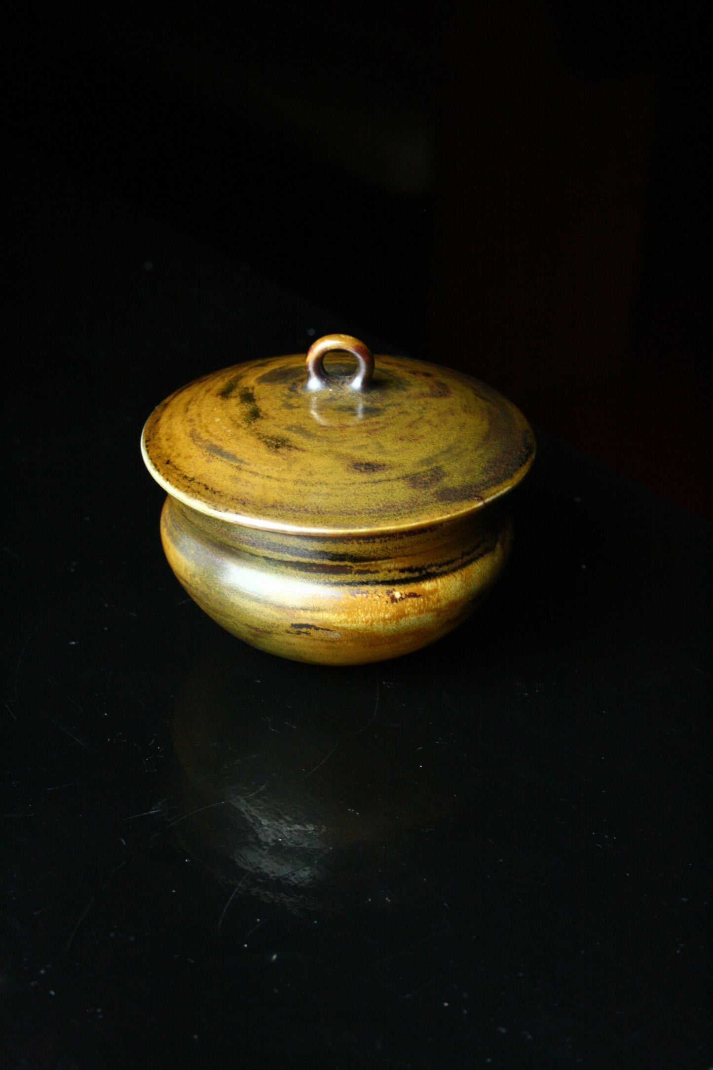 Lidded jar with loop handle
