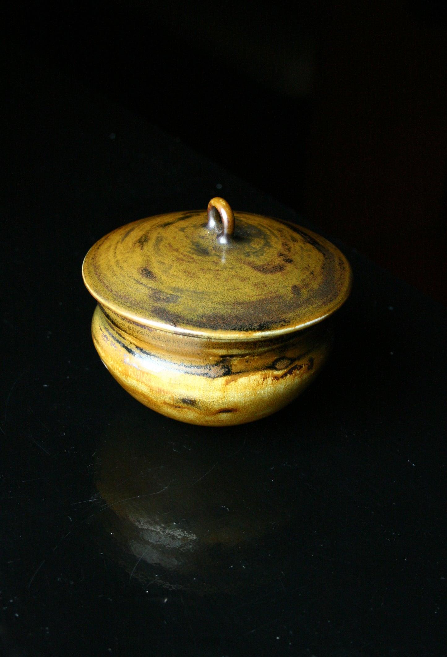 Lidded jar with loop handle