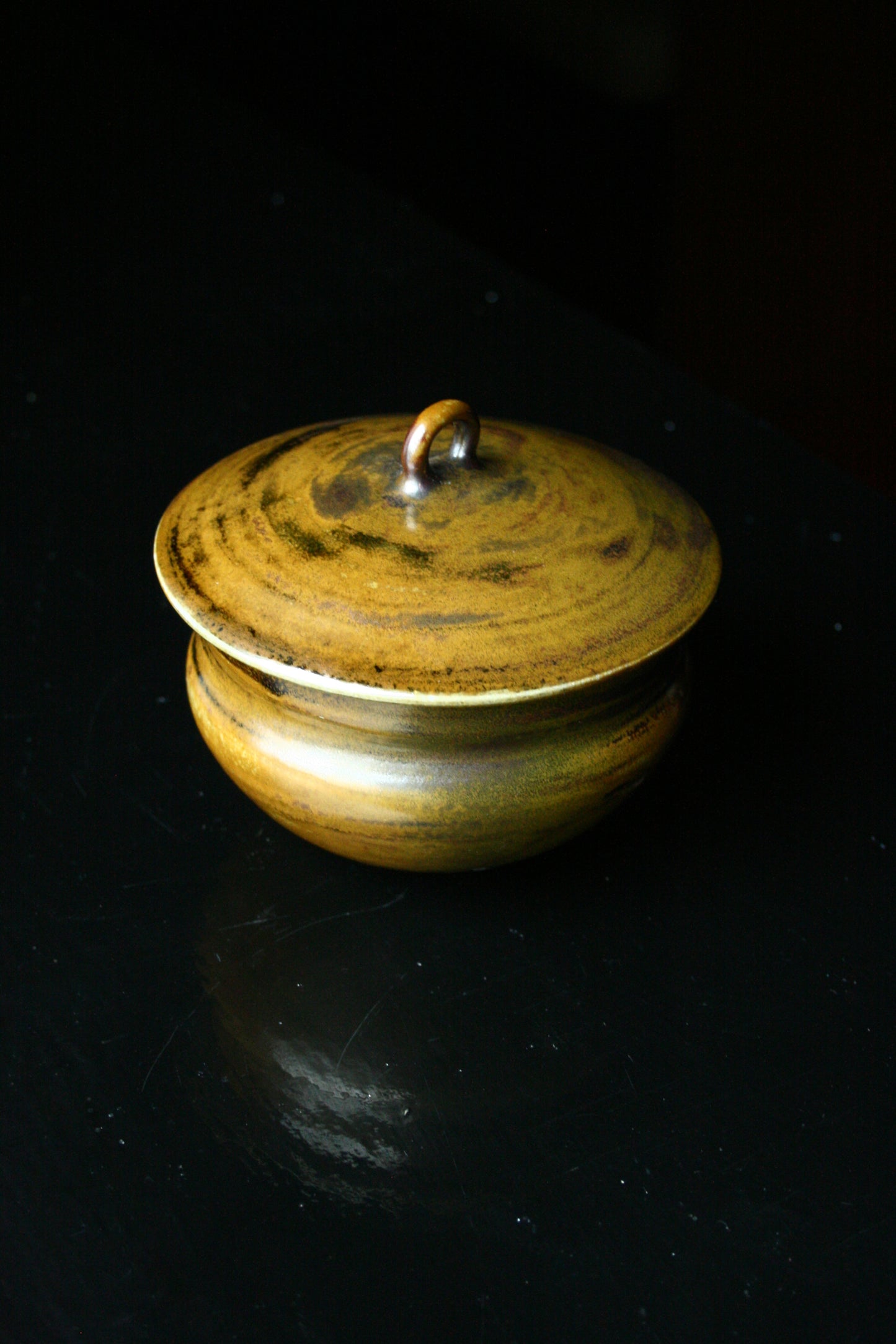 Lidded jar with loop handle