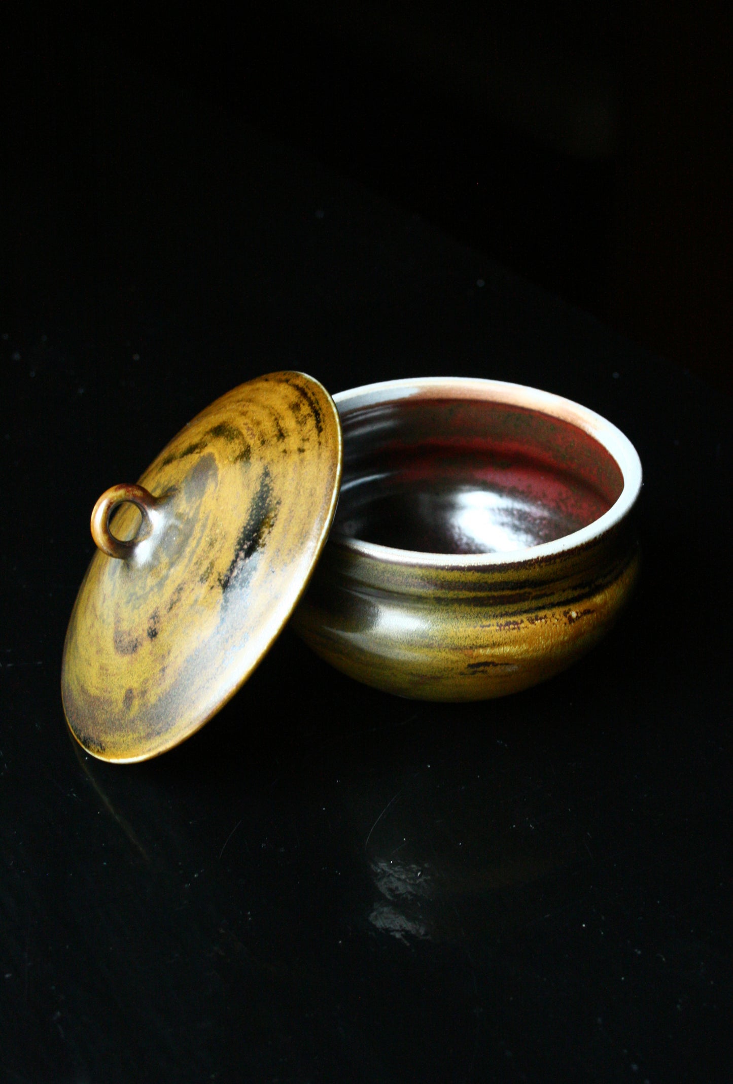 Lidded jar with loop handle